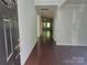 Inviting foyer boasts hardwood floors and an open view into the living spaces at 5031 Burnwald Ct, Fort Mill, SC 29715