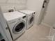 Bright laundry room featuring a white, front-load washer and dryer at 5031 Burnwald Ct, Fort Mill, SC 29715