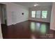 Spacious living room with hardwood floors, ample natural light, and modern accents at 5031 Burnwald Ct, Fort Mill, SC 29715