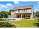 Expansive backyard with a pool, patio, and grassy area, perfect for outdoor activities and relaxation at 5105 Paisano Ln, Waxhaw, NC 28173