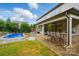 Backyard with a pool, covered patio and outdoor bar area, perfect for entertaining at 5105 Paisano Ln, Waxhaw, NC 28173