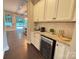 Stylish bar area with a wine fridge, sleek cabinets, and granite countertops at 5105 Paisano Ln, Waxhaw, NC 28173
