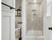 Elegant bathroom showcasing a tiled shower with a glass door and a modern toilet at 5105 Paisano Ln, Waxhaw, NC 28173