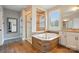 Luxurious bathroom with a soaking tub, tiled shower and double sink vanity at 5105 Paisano Ln, Waxhaw, NC 28173