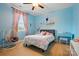 Bright bedroom with blue walls, decor, and a cozy hanging chair at 5105 Paisano Ln, Waxhaw, NC 28173