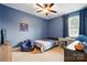 Bedroom featuring carpeted floors, a ceiling fan, and a desk with a wooden finish at 5105 Paisano Ln, Waxhaw, NC 28173