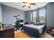 Bedroom featuring carpeted floors, a ceiling fan, and a desk in front of the window at 5105 Paisano Ln, Waxhaw, NC 28173