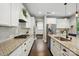Modern kitchen with stainless steel appliances, granite counters, and white cabinetry at 5105 Paisano Ln, Waxhaw, NC 28173