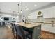 Bright, open kitchen with a large island, modern appliances, and seamless flow into the dining and living areas at 5105 Paisano Ln, Waxhaw, NC 28173