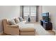 Comfortable living room with a large sofa, guitar, and media center at 5105 Paisano Ln, Waxhaw, NC 28173