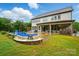 Spacious backyard with a kidney-shaped pool, a patio with seating, and an outdoor bar at 5105 Paisano Ln, Waxhaw, NC 28173