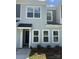 Charming two-story home with classic siding, multiple windows, and a cozy front porch at 5817 Tuckaseegee Rd, Charlotte, NC 28208