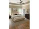 This bedroom boasts a ceiling fan, neutral walls, plush carpet, and abundant natural light at 6203 Flay Rd, Cherryville, NC 28021