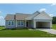 Charming single-story home with attached garage, lush lawn, and inviting curb appeal at 6203 Flay Rd, Cherryville, NC 28021