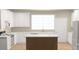 Bright kitchen with white cabinetry, stainless appliances, and center island at 6203 Flay Rd, Cherryville, NC 28021