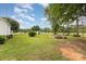 This vast backyard offers a serene view of lush greenery, garden beds and potential for outdoor activities at 733 Osteen Rd, York, SC 29745