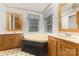 A full bathroom with a soaking tub and double sinks at 733 Osteen Rd, York, SC 29745