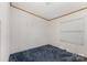 A modest bedroom with blue carpet and a single window at 733 Osteen Rd, York, SC 29745
