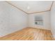 An empty bedroom showcasing beautiful hardwood floors and natural light at 733 Osteen Rd, York, SC 29745