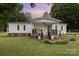 Charming single-story home featuring a welcoming front porch and beautifully landscaped front yard at 733 Osteen Rd, York, SC 29745
