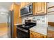Kitchen with stainless steel oven and microwave with wood cabinets at 733 Osteen Rd, York, SC 29745