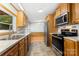 A well-lit kitchen featuring stainless steel appliances and wood cabinets at 733 Osteen Rd, York, SC 29745