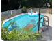 A private in-ground pool with a swan floaty and lounge chairs at 733 Osteen Rd, York, SC 29745
