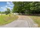 Scenic property showcasing the home, lush greenery, and a long gravel driveway, offering privacy at 733 Osteen Rd, York, SC 29745