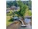 Aerial view showcasing the property's lake access, backyard amenities, and surrounding landscape at 8005 Island View Ct, Denver, NC 28037