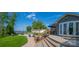 Inviting backyard with patio, outdoor seating, lake views, and manicured lawn at 8005 Island View Ct, Denver, NC 28037