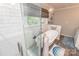 Bathroom with free-standing tub and glass-enclosed shower features a neutral color palette at 8005 Island View Ct, Denver, NC 28037