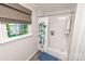 Bright bathroom featuring a shower-tub combo, subway tile, and view of the lake at 8005 Island View Ct, Denver, NC 28037