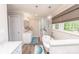 Bright bathroom with a free-standing tub, glass-enclosed shower, and marble countertops at 8005 Island View Ct, Denver, NC 28037