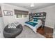Cozy bedroom with a bunk bed, bean bag chair, and neutral colors creating a relaxing atmosphere at 8005 Island View Ct, Denver, NC 28037