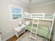 Bedroom features bunk beds, a large window, and ample natural light at 8005 Island View Ct, Denver, NC 28037