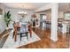 Open-concept dining room adjacent to a modern kitchen and a view into the living area at 8005 Island View Ct, Denver, NC 28037