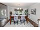 A beautifully decorated dining room features seating for six and elegant modern decor at 8005 Island View Ct, Denver, NC 28037
