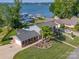 Charming brick home boasts lakeside living with docks, pool and lush green lawns at 8005 Island View Ct, Denver, NC 28037