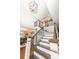 Elegant two-story foyer with wood staircase, modern light fixture, and open dining area at 8005 Island View Ct, Denver, NC 28037