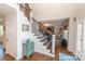 Inviting foyer featuring a staircase with wooden rails and open access to the living area at 8005 Island View Ct, Denver, NC 28037