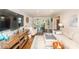 Spacious living room with hardwood floors, decorative wallpaper, and an abundance of natural light at 8005 Island View Ct, Denver, NC 28037