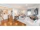 Bright living room with modern furniture and hardwood floors adjacent to the kitchen at 8005 Island View Ct, Denver, NC 28037
