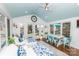 Bright sun room features a vaulted ceiling, white table with seating, and views of the outdoors at 8005 Island View Ct, Denver, NC 28037