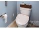 Toilet with a modern bidet attachment and neutral tiling for a clean bathroom aesthetic at 8033 Pawleys Ct, Fort Mill, SC 29707