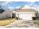 Home featuring a two-car garage, well-maintained lawn, and inviting curb appeal at 8033 Pawleys Ct, Fort Mill, SC 29707