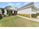 Home with manicured lawn, brick accents, and a charming covered entry at 8033 Pawleys Ct, Fort Mill, SC 29707