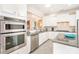 Modern kitchen with stainless steel appliances, granite countertops, and a view to the dining area at 8033 Pawleys Ct, Fort Mill, SC 29707