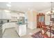 Bright kitchen with white cabinets, granite countertops, and a stainless steel oven at 8033 Pawleys Ct, Fort Mill, SC 29707