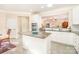 Bright kitchen with granite countertops, white cabinets, and stainless steel appliances at 8033 Pawleys Ct, Fort Mill, SC 29707
