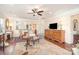 Open living area with hardwood floors, classic furnishings, and a pass-through view to the kitchen at 8033 Pawleys Ct, Fort Mill, SC 29707